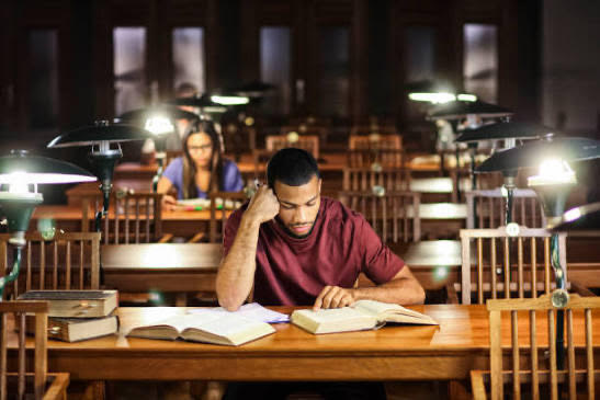 Students studying with solar lamps